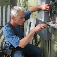 Theo Howe working on an electrical panel